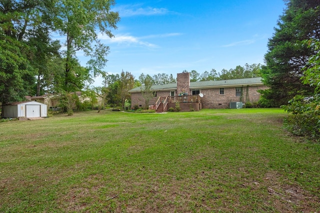 view of yard with a shed and a deck