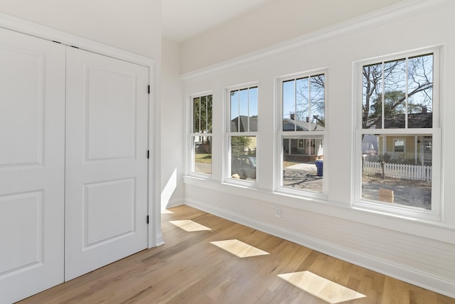 interior space with light wood-type flooring and baseboards