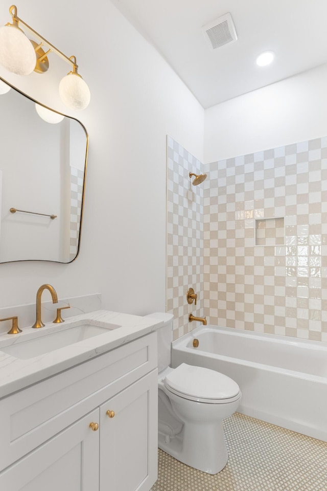 bathroom featuring visible vents, toilet, tile patterned flooring, shower / bath combination, and vanity