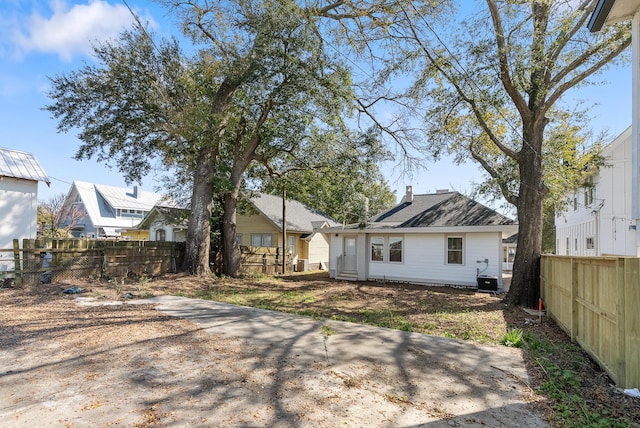 rear view of house with fence