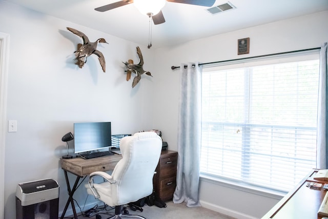 office space featuring a ceiling fan and carpet flooring