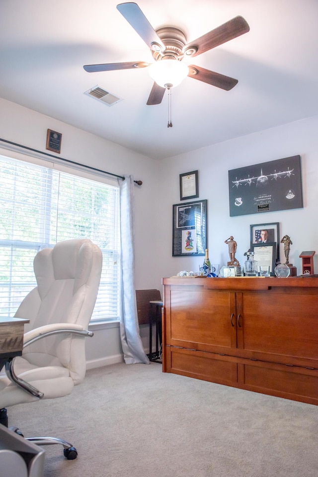 office with light colored carpet, ceiling fan, and baseboards