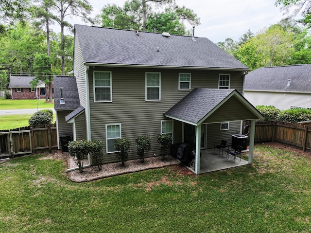 back of house featuring a patio, a shingled roof, and central air condition unit