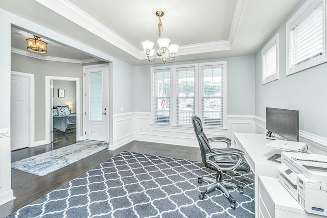 office space featuring ornamental molding, dark hardwood / wood-style floors, an inviting chandelier, and a tray ceiling