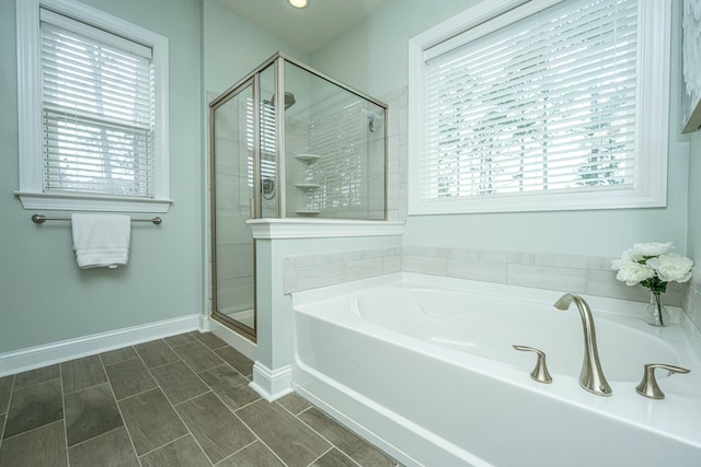 bathroom with plenty of natural light and plus walk in shower