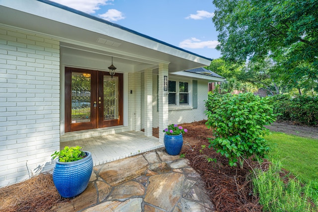 881 Evans Rd, Charleston, SC 29412 - view of exterior entry featuring brick siding and french doors