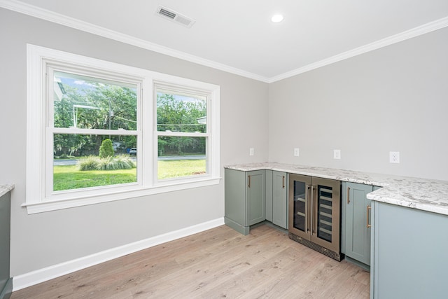 881 Evans Rd, Charleston, SC 29412 - indoor dry bar with beverage cooler, crown molding, baseboards, light wood-style flooring, and recessed lighting