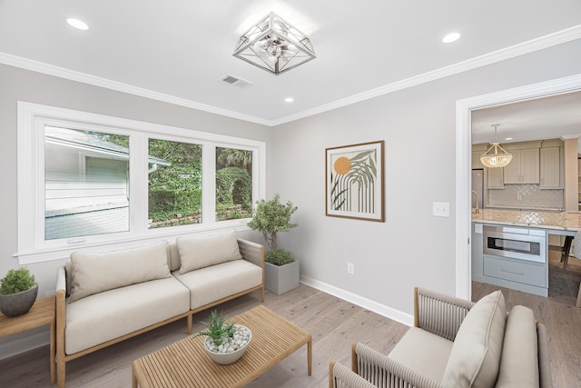 881 Evans Rd, Charleston, SC 29412 - living room with baseboards, ornamental molding, recessed lighting, and light wood-style floors