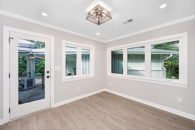 881 Evans Rd, Charleston, SC 29412 - empty room with crown molding, light wood-type flooring, baseboards, and recessed lighting
