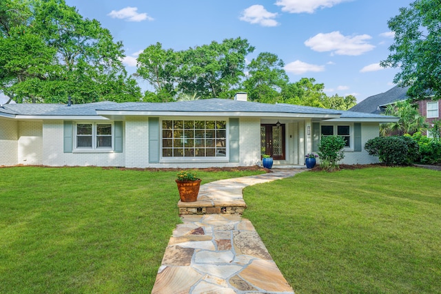 881 Evans Rd, Charleston, SC 29412 - ranch-style home with brick siding, a front yard, a chimney, and a shingled roof