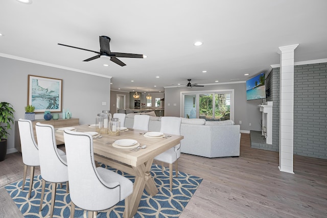 881 Evans Rd, Charleston, SC 29412 - dining room with ceiling fan, ornamental molding, wood finished floors, a fireplace, and recessed lighting