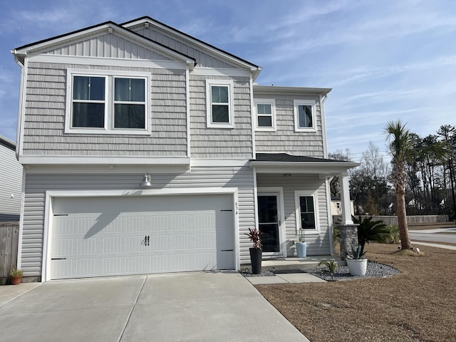 view of front of house with a garage, board and batten siding, driveway, and a porch