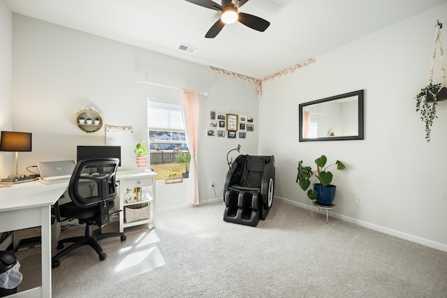 office area featuring visible vents, baseboards, a ceiling fan, and carpet floors