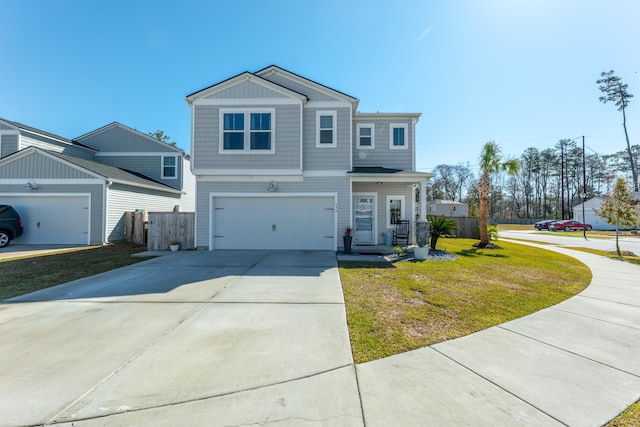 craftsman-style house featuring a front yard, an attached garage, driveway, and fence