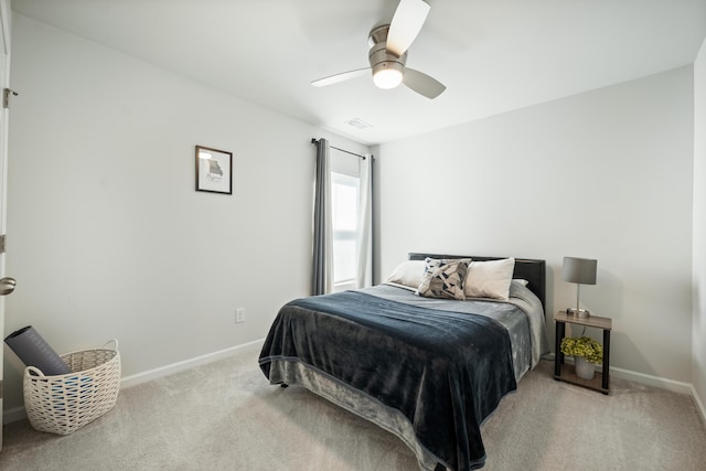 bedroom with visible vents, baseboards, a ceiling fan, and carpet flooring