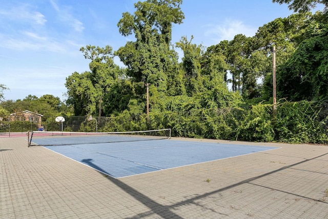 view of tennis court with fence