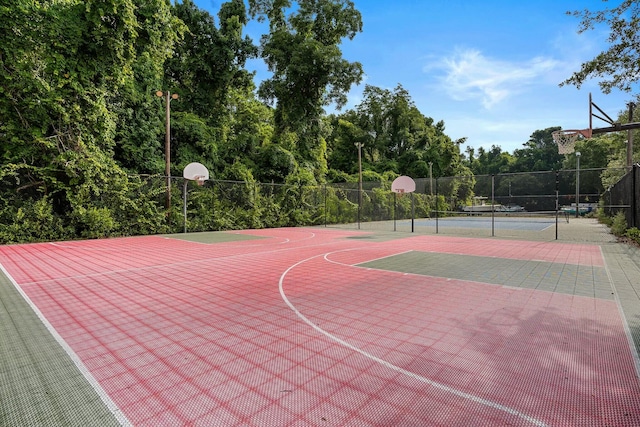 view of sport court featuring community basketball court and fence