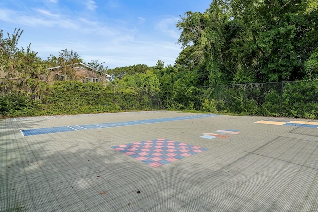 view of swimming pool with fence