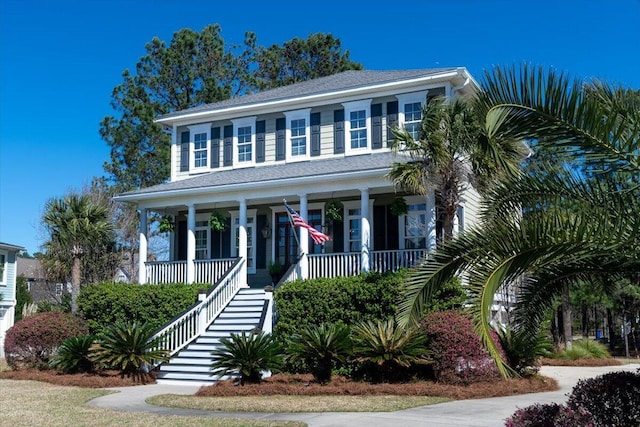 view of front of house with covered porch and stairs