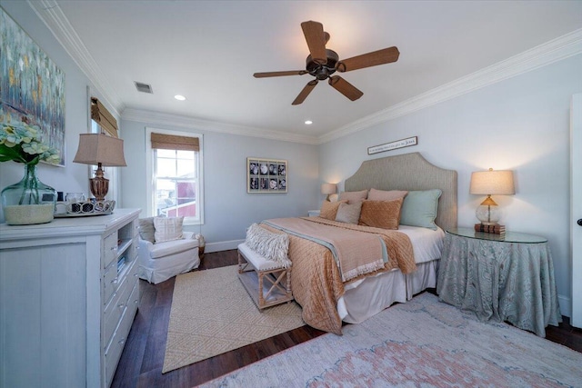 bedroom featuring visible vents, baseboards, a ceiling fan, wood finished floors, and crown molding