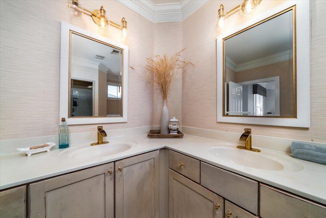 bathroom featuring double vanity, ornamental molding, and a sink