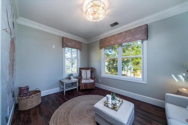 sitting room featuring ornamental molding, wood finished floors, visible vents, and baseboards