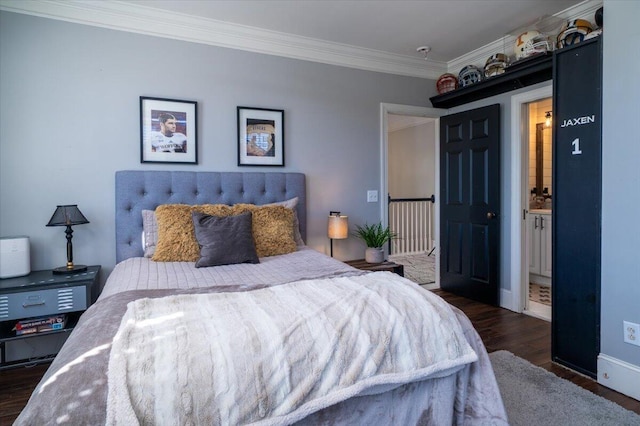 bedroom with dark wood-style flooring, crown molding, and baseboards