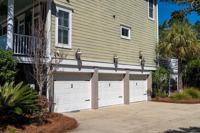 view of home's exterior featuring an attached garage and concrete driveway