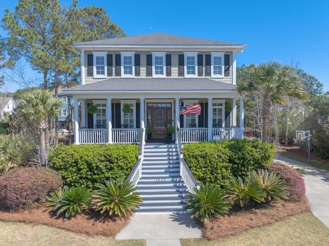 view of front facade with a porch, french doors, and stairs