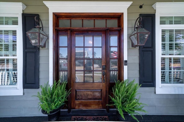 property entrance with covered porch