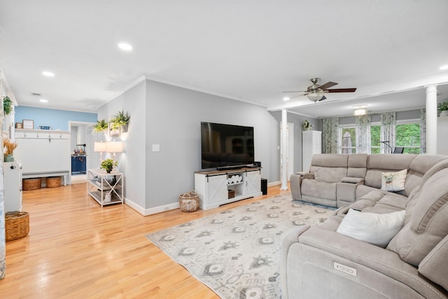 living room with ceiling fan, light wood finished floors, baseboards, recessed lighting, and crown molding