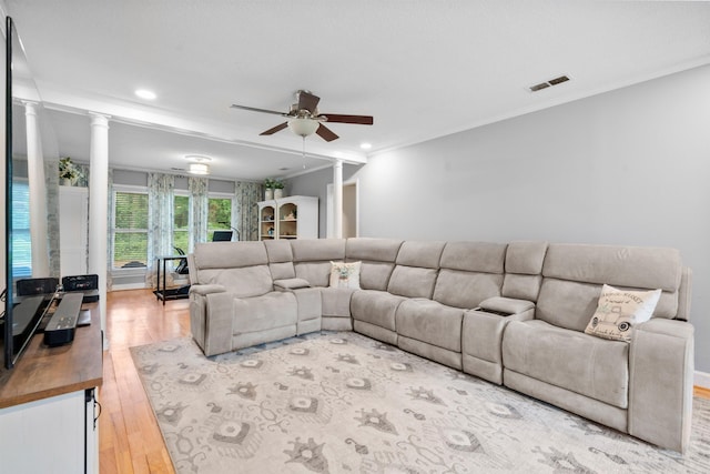 living area with wood finished floors, a ceiling fan, crown molding, ornate columns, and recessed lighting