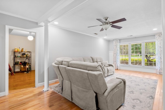 living room with decorative columns, ceiling fan, ornamental molding, light wood-style floors, and recessed lighting