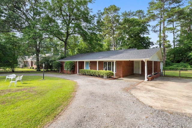 ranch-style home with driveway and brick siding