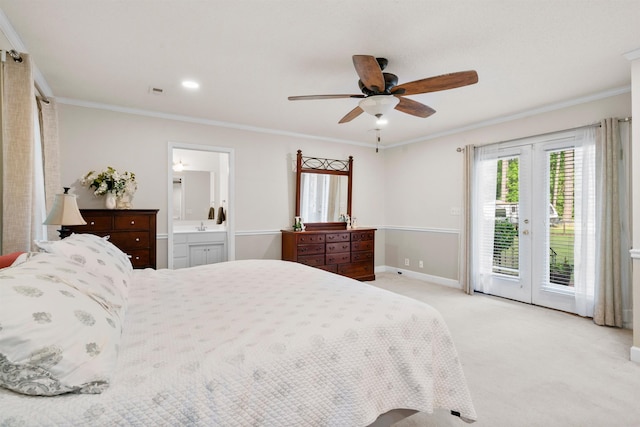 bedroom with access to outside, crown molding, ensuite bathroom, light carpet, and french doors