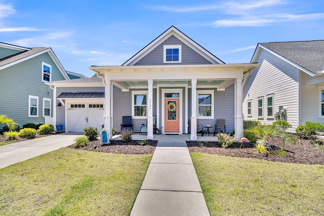 3529 Habenaria Rd Unit 33, Mount Pleasant, SC 29466 - view of front of house featuring an attached garage, covered porch, driveway, and a front yard