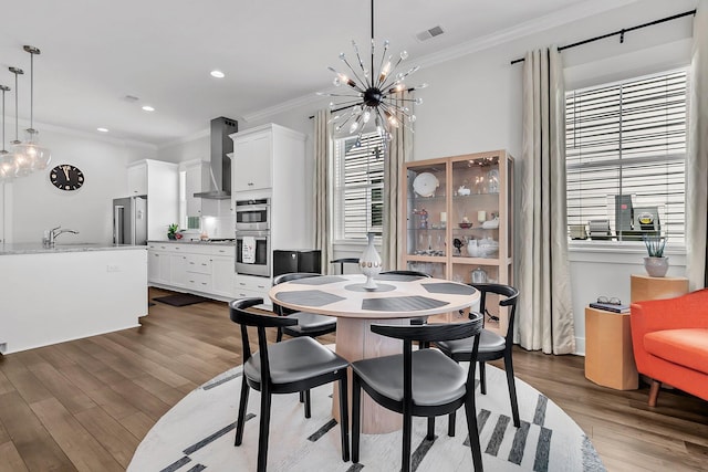 3529 Habenaria Rd Unit 33, Mount Pleasant, SC 29466 - dining space with a chandelier, crown molding, dark wood-style floors, and recessed lighting