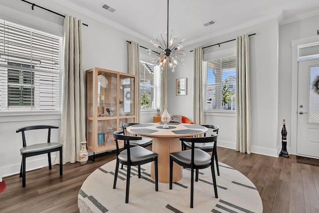 3529 Habenaria Rd Unit 33, Mount Pleasant, SC 29466 - dining room with a chandelier, dark wood-type flooring, crown molding, and baseboards