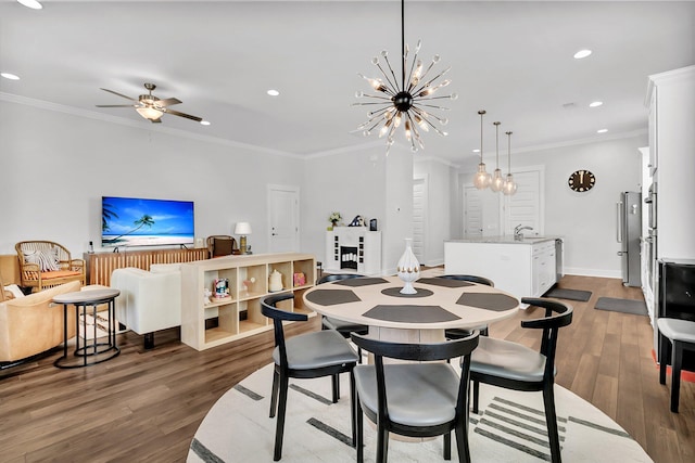 3529 Habenaria Rd Unit 33, Mount Pleasant, SC 29466 - dining area featuring wood finished floors, crown molding, recessed lighting, a chandelier, and ceiling fan