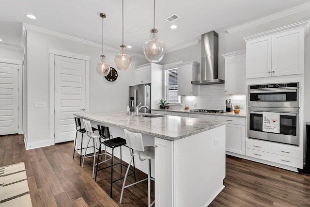 3529 Habenaria Rd Unit 33, Mount Pleasant, SC 29466 - kitchen featuring wall chimney exhaust hood, appliances with stainless steel finishes, a sink, crown molding, and backsplash