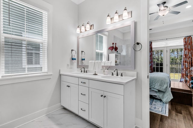 3529 Habenaria Rd Unit 33, Mount Pleasant, SC 29466 - ensuite bathroom featuring double vanity, baseboards, a ceiling fan, crown molding, and marble look tile flooring