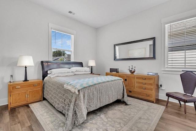 3529 Habenaria Rd Unit 33, Mount Pleasant, SC 29466 - bedroom featuring light wood-type flooring and baseboards