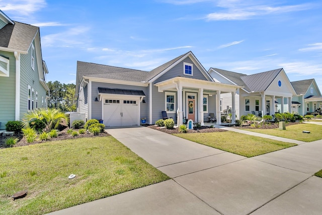 3529 Habenaria Rd Unit 33, Mount Pleasant, SC 29466 - view of front of home featuring a garage, driveway, a front lawn, and covered porch