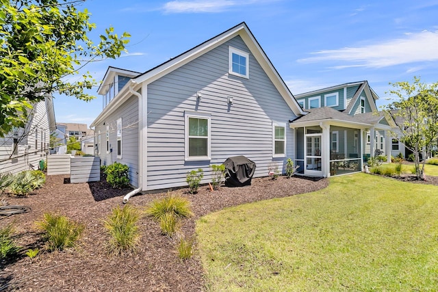 3529 Habenaria Rd Unit 33, Mount Pleasant, SC 29466 - rear view of property featuring a lawn and a sunroom