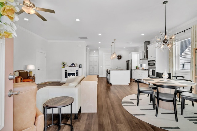 3529 Habenaria Rd Unit 33, Mount Pleasant, SC 29466 - dining space with crown molding, a chandelier, dark wood-style flooring, recessed lighting, and a ceiling fan