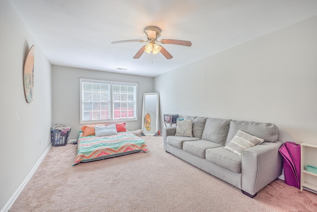 carpeted bedroom featuring visible vents, ceiling fan, and baseboards