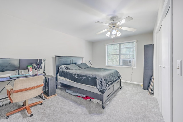 carpeted bedroom with baseboards and ceiling fan