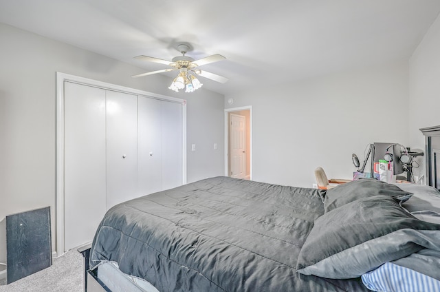 bedroom with a closet, ceiling fan, and carpet