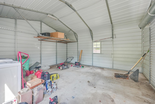 garage with washer / dryer and metal wall