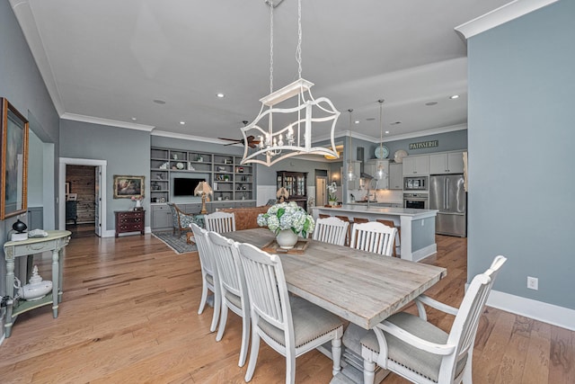 225 Camber Rd, Huger, SC 29450 - dining space with crown molding, recessed lighting, light wood finished floors, a chandelier, and baseboards